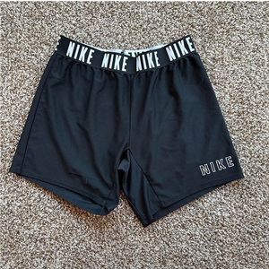 Black Nike shorts.